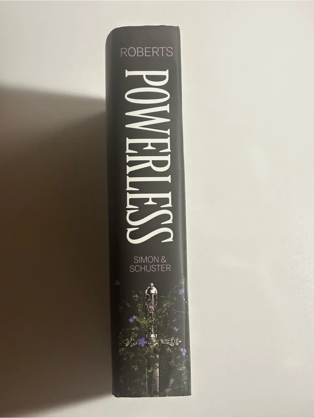 Powerless by Lauren Roberts - Black Cover with Purple Floral Accents